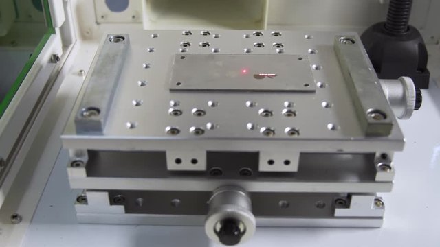 MOPA fiber laser machine engraving on a metal plate, tilt shot