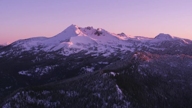Oregon circa-2018. Aerial view of Broken Top Mountain at sunrise. Shot from helicopter with Cineflex gimbal and RED Epic-W camera.