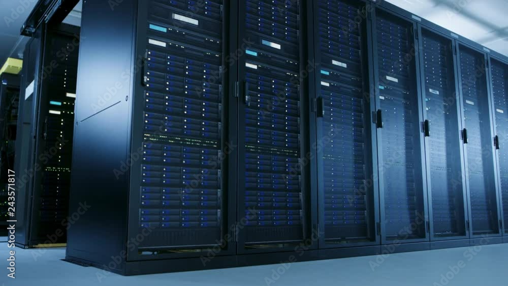 Fototapete Low Angle Moving Shot of Data Center With Multiple Rows of Fully Operational Server Racks. Modern Telecommunications, Cloud Computing Artificial Intelligence Database, Supercomputer Technology Concept