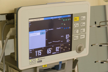 Hospital monitor with pressure and pulse control.