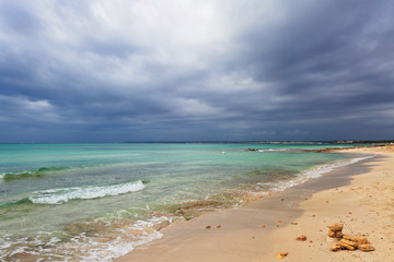 Es Trenc beach under gloomy sky