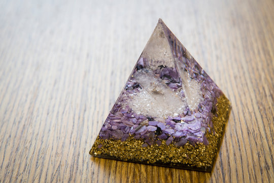 Orgonite - pyramid with crystals inside.