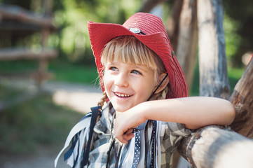 little smile cowboy girl on the ranch.