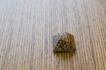 Orgonite - a pyramid with brass and crystal.