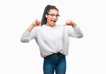Fototapeta premium Young braided hair african american girl wearing glasses and sweater over isolated background looking confident with smile on face, pointing oneself with fingers proud and happy.