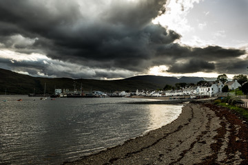 City Of Ullapool With Harbor And Boats Facing Heavy Weather At Loch Broom In Scotland