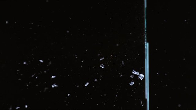 Slow motion shot of bullet shooting through glass, shot with Phantom Flex 4K camera.