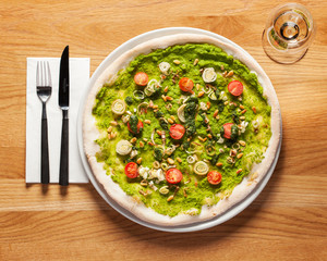 Authentic Italian Pizza - Delicious vegan Pizza, beautifully arranged on a wooden table