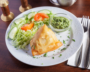 Indian food, Samosa - Top down view of delicious oriental dish, beautifully arranged on a white plate