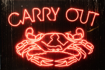 Neon carry out crab sign