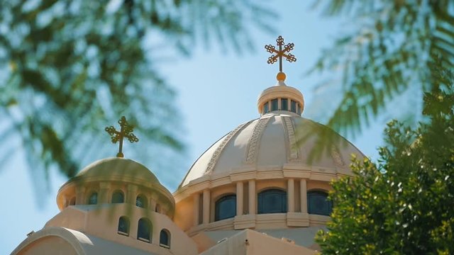 Coptic Church of Sharm el-Sheikh with spherical domes and crosses in slow motion   