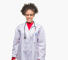 Young afro american doctor woman over isolated background winking looking at the camera with sexy expression, cheerful and happy face.