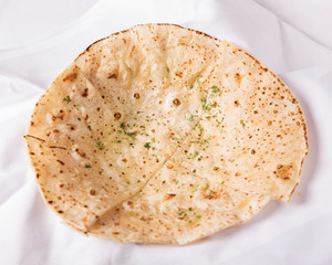 Indian food, Naan bread -  Delicious oriental starters, beautifully arranged for dinner on a white cloth