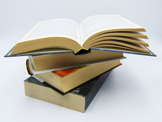 Pile of books on a table in white background 