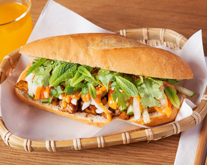 Vegan eggplant sandwich, beautifully arranged with spices and surved on a wooden table