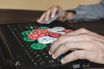Gambling addiction on internet. Man playing poker online