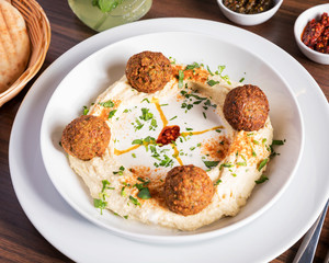 Arabic food, Falafel Humus - Delicious humus with falafel, beautifully arranged on a white plate