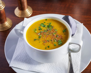 Indian food, dal soup - Delicious oriental dish, beautifully arranged on a wooden table