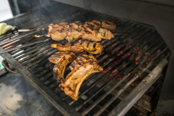The process of cooking meat on the grill