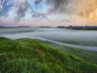 spring morning valley of the picturesque river. foggy dawn
