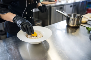 Cooking pasta with egg and parmesan cheese