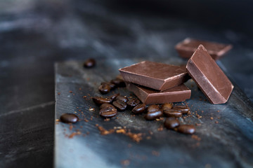 milk chocolate and coffee beans in kitchen for dessert making