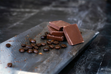 milk chocolate and coffee beans in kitchen for dessert making