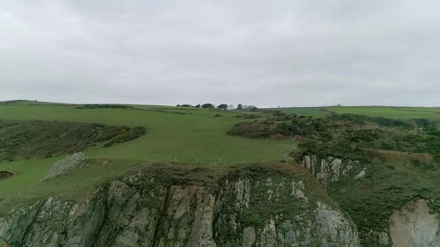 Aerial tracking backwards out to sea revealing an amazing stunning south Devon coastline, Just south of Dartmouth near the inner combe rocks. A great tribute to the south west coast path.