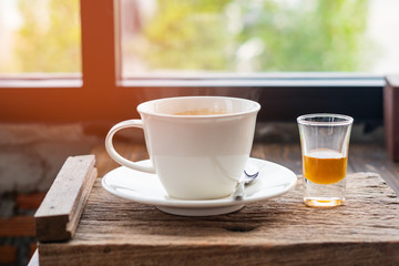 hot coffee and honey on wood table