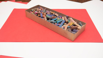 Box of Chalk on Paper