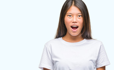 Young asian woman over isolated background afraid and shocked with surprise expression, fear and excited face.