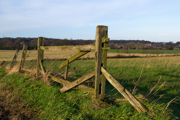 Fototapeta na wymiar Old wooden fence outside of Northwestern English farmland in Wigan, England.