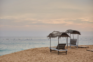 two sun loungers. Midigama Beach. Sunset in the Indian ocean. Midigama, Sri Lanka
