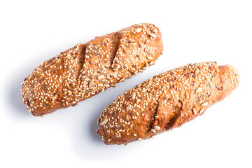 Rye bread with sunflower seeds, sesame and flax isolated on white.