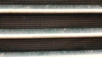 Dirty grill/radiator of a semi truck - Powered by Adobe