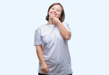 Fototapeta premium Young adult woman with down syndrome over isolated background looking confident at the camera with smile with crossed arms and hand raised on chin. Thinking positive.