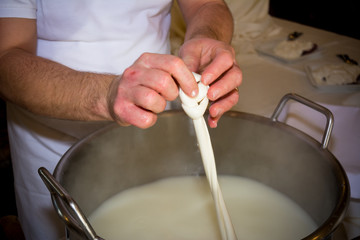 Close Up of the Hand Made Preparation of Italian Traditional Cheese called Mozzarella