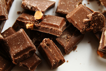 Chocolate background / Chocolate is a usually sweet, brown food preparation of roasted and ground...