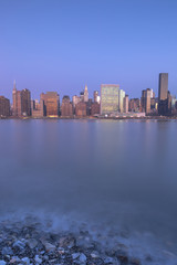 View on Manhattan from east river at sunrise with long exposure