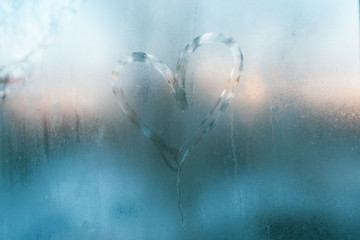 Frozen heart in window. Valentines day concept.