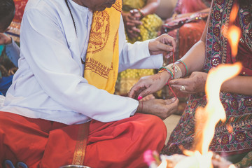 Indian pre wedding ceremony haldi red thread
