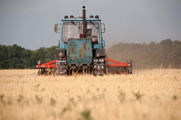 Tractor preparing land for sowing