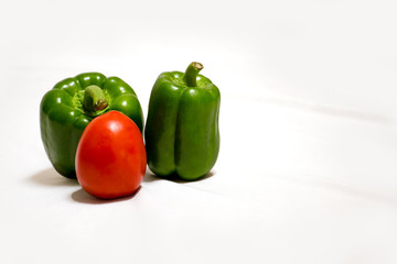 Tomato and Green Peppers on white background