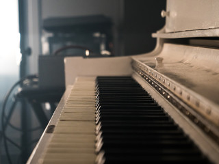 White Upright Piano in Recording Studio