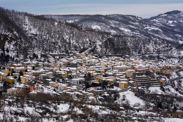 Horizontal View of the town of Terranova di Pollino in Winter, Covered with Snow