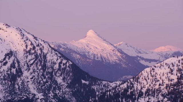 British Columbia, Canada circa-2018. Aerial view of snow covered mountain range.  Shot from helicopter with Cineflex gimbal and RED Epic-W camera.