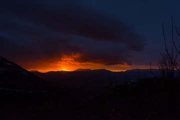 Mountain Landscape at Sunset on Cloudy Sky Background