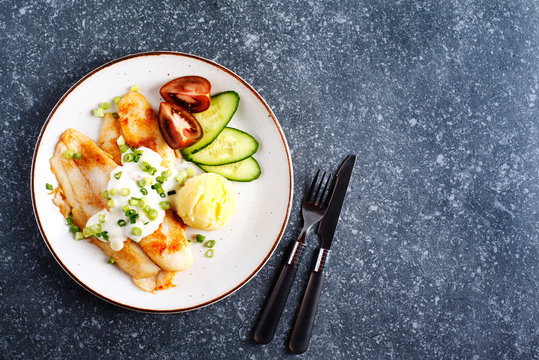 Fried Basa Fillet with sauce, mashed potato and fresh vegetables