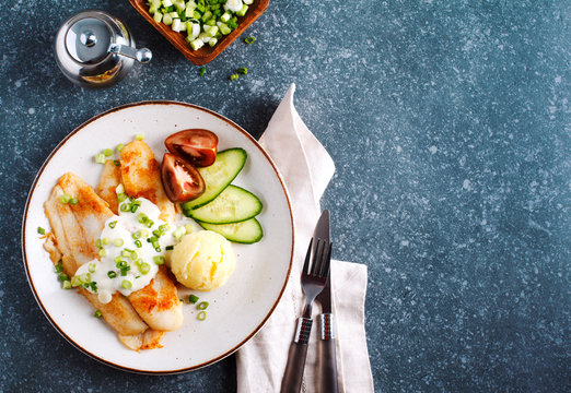 Fried Basa Fillet with sauce, mashed potato and fresh vegetables