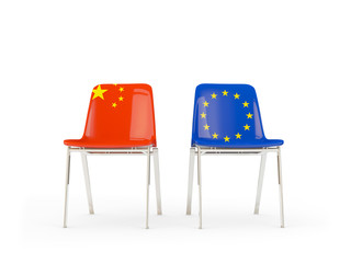 Two chairs with flags of China and EU isolated on white